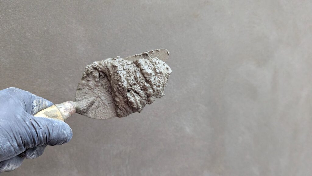 Concrete crack repair hand trowelling